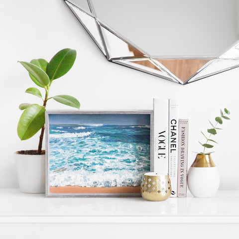 Home Decor - Plants, Picture Frames, Books, and a Candle