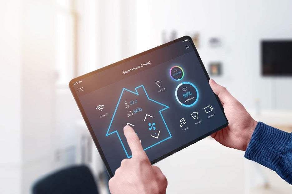 A person controlling their smart home from a tablet.