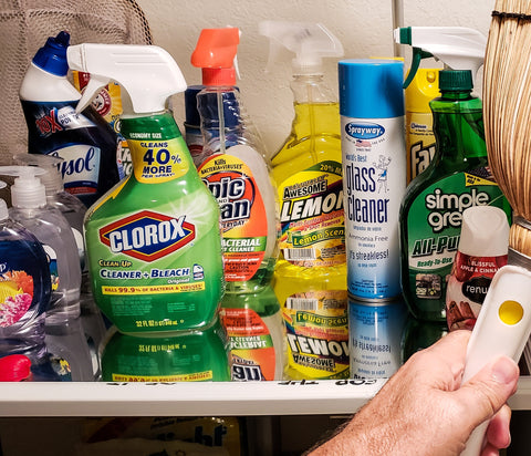 Man Reaching in his Utility Closet for Broom