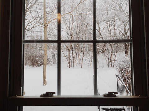 Snowy Window Scene Outside a House